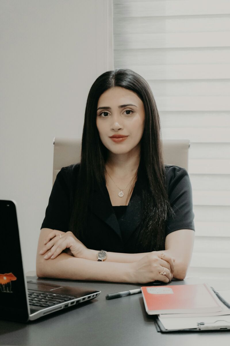 A professional woman at her office desk