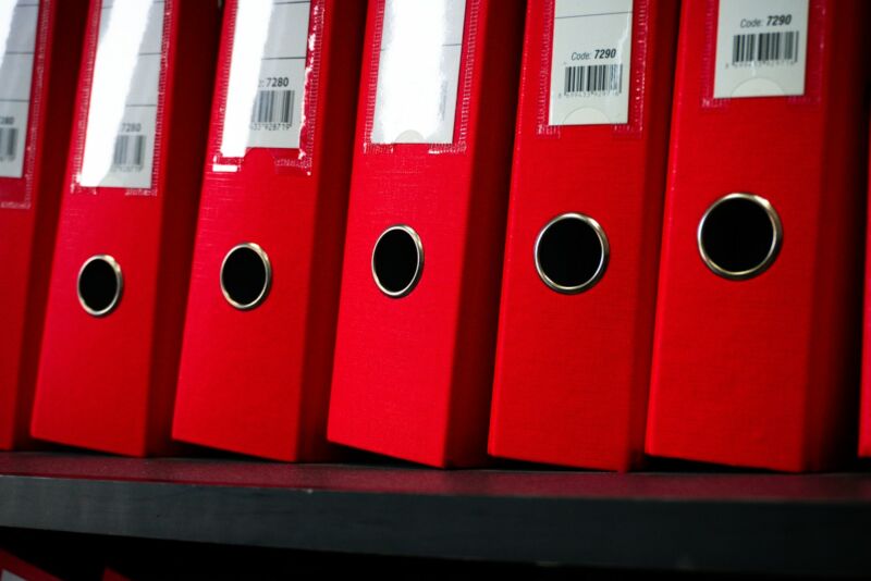 File folders neatly arranged on a shelf